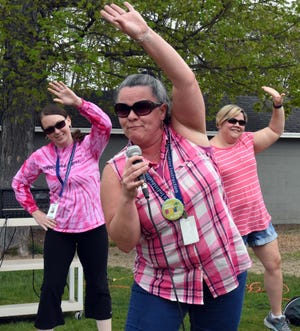 Led by Stacey Newman, third-grade teachers shifted Friday’s pep rally into high gear with a rap-fitness routine, "Get Fit in May May." The pep rally was held in anticipation of Saturday’s 18th Annual Exeter PTO Get Fit in May Race. Photo by Buzz Dietterle/seacoastonline