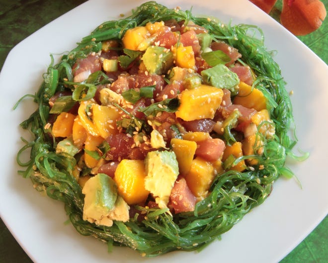 Tuna Poke with Mango and Avocado is inspired by Hawaii's take on fish tartare, flavored with an Asian-inspired dressing. The Providence Journal/Sandor Bodo