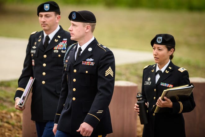 Army Sgt. Bowe Bergdahl, center, arrives at the Fort Bragg courtroom facility for an arraignment hearing on Tuesday, May 17, 2016 on Fort Bragg, N.C. The hearing could result in his court-martial being moved until after this fall's elections. (Andrew Craft/The Fayetteville Observer via AP) MAGS OUT, NO SALES