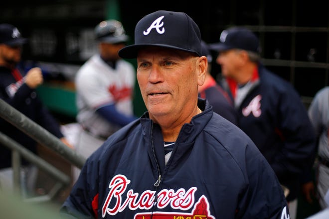 Atlanta Braves interim manager Brian Snitker stands in the dugout before the team's baseball game against the Pittsburgh Pirates in Pittsburgh, Tuesday, May 17, 2016. (AP Photo/Gene J. Puskar)
