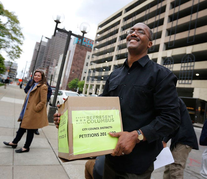 Represent Columbus co-chair Jonathan Beard helped deliver more than 38,000 signatures to City Hall.