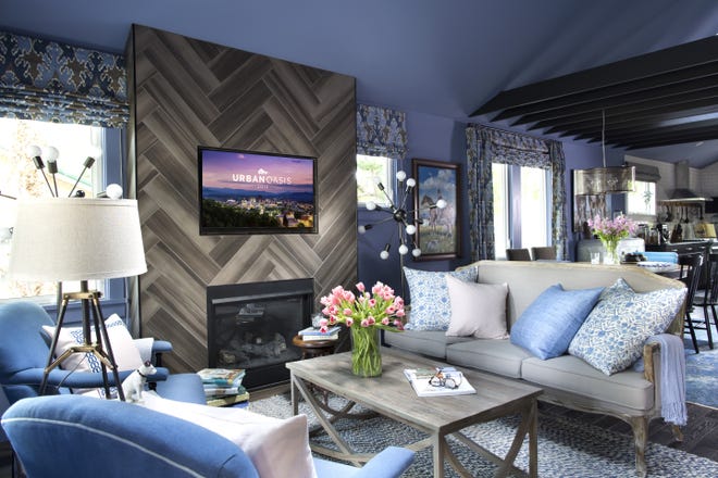 Brian Patrick Flynn designed this living room for HGTV's "Urban Oasis 2015" house, which had ceilings barely 8 feet high that were raised as shown to create a dramatic open space. (Sarah Dario/Flynnside Out/Scripps Networks Interactive via AP)