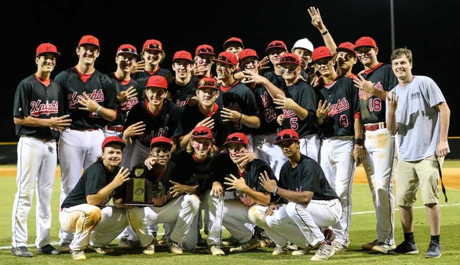 GARY McCULLOUGH/CORRESPONDENT Creekside poses with the trophy for winning the District 4-7A championship after defeating Nease on April 20 at Creekside High School.