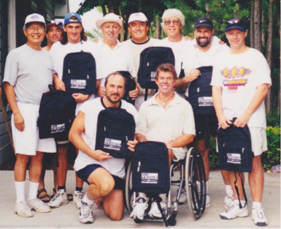 Ed Kellerman and Johnny Johnston, in front, pictured in 2000 with their state runner-up U.S. Tennis Association team.