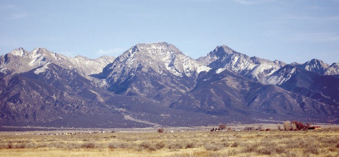 CHIEFTAIN PHOTO/FILE Views like this one of the Sangre de Cristo Mountains above the town of Crestone in the San Luis Valley are what draws campers to Colorado's high country.
