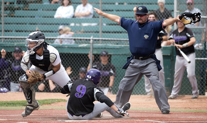 Sedgewick's Jake Garnas scores the go-ahead as Rye catcher Bailey Benz looks to throw the ball to another base during their 2A semifinal game Saturday, May 24, 2014 at Hobbs Field in Pueblo, Colo. Rye lost 4-1 in extra innings to end their season. (Chris McLean, The Pueblo Cheiftain)