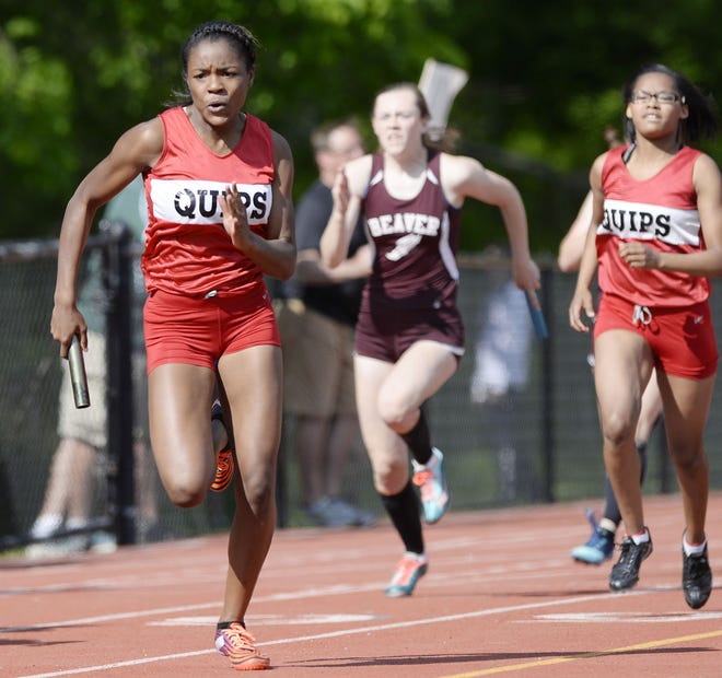 Aliquippa's Innocense Ross, left, runs the anchor leg of the  Class AA girls 400-meter relay at the WPIAL track championships Thursday at Baldwin High School.