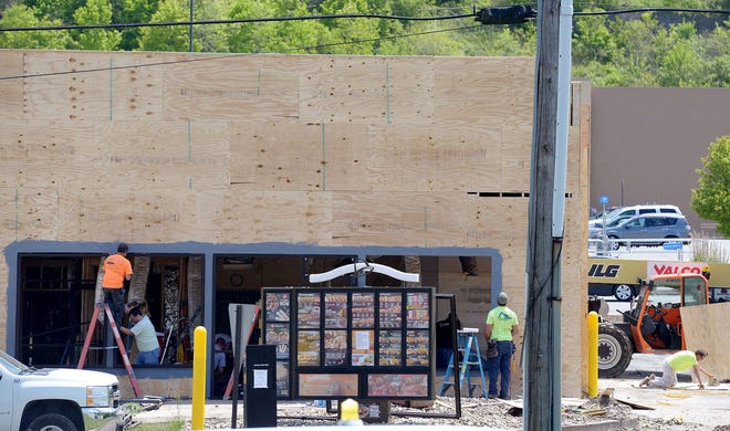 Workers renovate the Taco Bell and Pizza Hut building on Brodhead Road in Center Township.