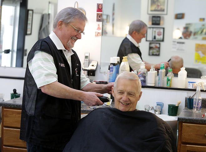 Don McClaskey , owner of Dads and Lads barber shop cuts regular customer Dick Happoldt's hair. Dick has been coming to the shop for 6 years. 

(IndeOnline.com / Kevin Whitlock)