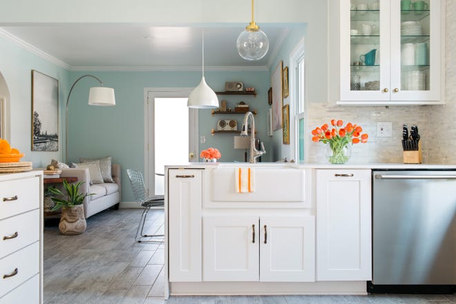 When considering how to update her 20-year-old kitchen, Lindsey Paris of Atlanta worried about the cost and inconvenience to her family of four, which includes two children, ages five and 10 months. She decided to reface the original cabinets with white solid-wood door fronts, and replace the backsplash and “awful laminate” counters with granite. “We got a completely new look without a total gut,” she says, adding that the two weeks with no kitchen was well worth it. [PHOTOS PROVIDED BY LINDSEY PARIS]
