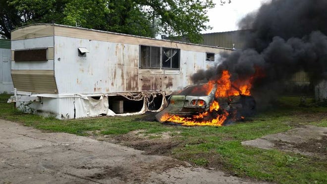 A car was engulfed in fire in the Caravan Mobile Park, 106 N.W. Highway 24.