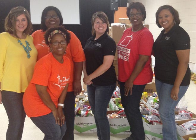 Pictured helping with the distribution are Emily Domangue, Mary Frank, Donna Richard, Tessie Grigg, Tashanti Pitts, and Gloria Anderson with the Greater Baton Rouge Food Bank.