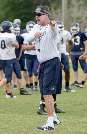 Walton head coach Jimmy Ray Stephens instructs his players during a recent spring football practice.