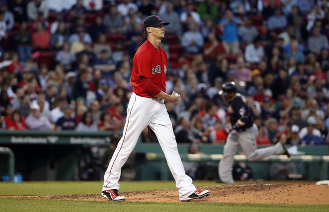 Clay Buchholz walks back to the mound after giving up a three-run home run to Cleveland's Jason Kipnis on Friday night. AP Photo