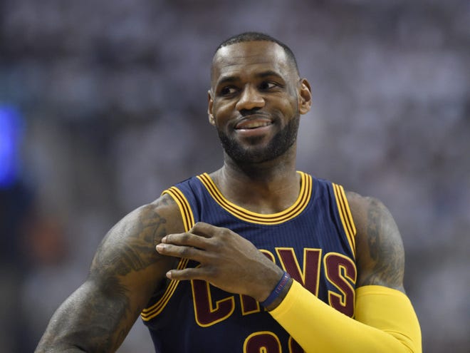 Cleveland Cavaliers forward LeBron James smiles during the first half of Game 3 of the NBA Eastern Conference finals against the Toronto Raptors Saturday in Toronto. (Frank Gunn/The Canadian Press via AP)
