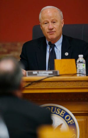 U.S. Rep. Mike Coffman,R-Colo , back, directs a question to a witness during a House Veterans Affairs subcommittee field hearing on VA hospitals and prescription drugs for veterans Friday, May 20, 2016, in the State Capitol in Denver. The House subcommittee heard from three Colorado-based VA officials during the field hearing.