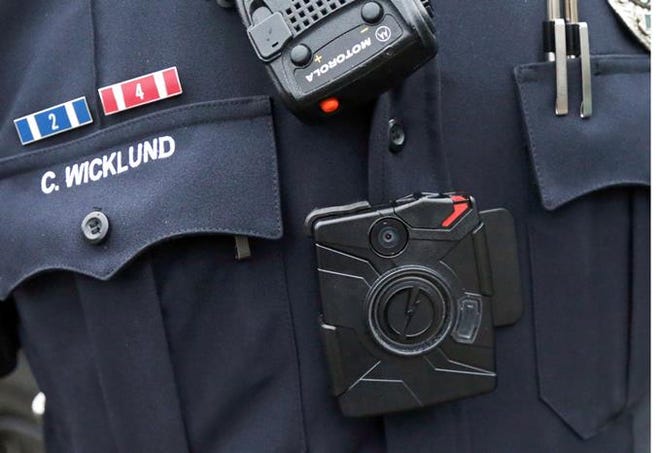 A Burnsville, Minnesota, police officer wears a body camera attached to his uniform. Columbus plans to invite proposals from camera vendors this week.