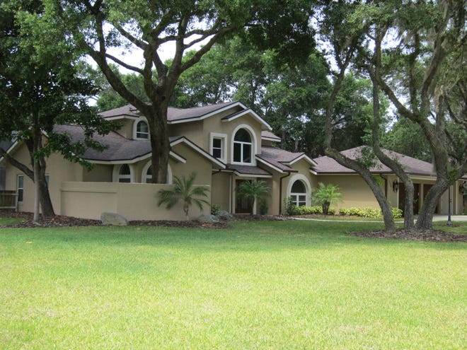 This modern-style custom house for sale in the Spruce Creek Fly-In near Port Orange sits on a 1.2-acre lot that has a dock on Spruce Creek. NEWS-JOURNAL/BOB KOSLOW
