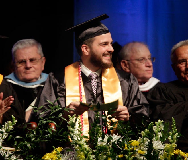 Brandon Langdon of Middletown is introduced to fellow graduates Friday during Community College of Rhode Island's 51st commencement. The Providence Journal/Kris Craig