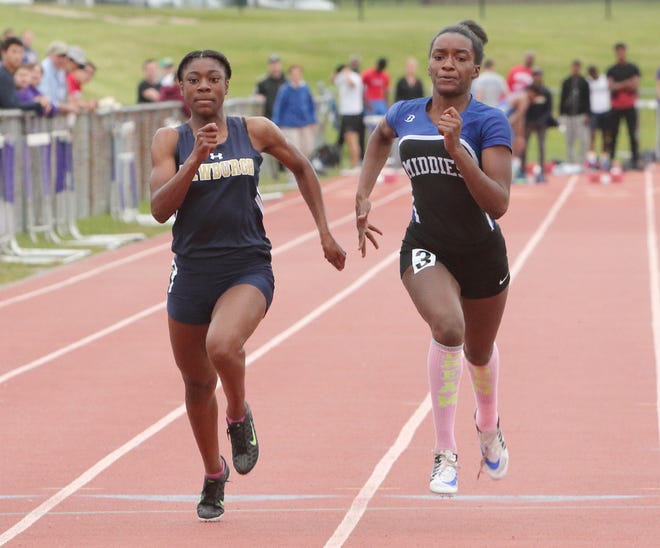 Middletown's De'ja Bowen, left, and Newburgh Free Academy's Ahnrea McCaskill tied for first place at the 100-meter dash at the OCIAA Track and Field Championships in Warwick on Saturday. For a photo gallery, go to www.recordonline.com.

DAWN J. BENKO/For the Times Herald-Record