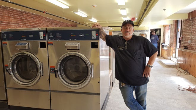 Rick Ciampa stands in his partially completed Laundromat in York, Maine. He is hoping that the business will be open for business by mid-June. Deborah McDermott photo