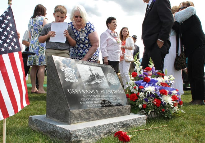 Derek Robert, 9, stands beside his grandmother, Jo Anne Messier-Derosiers, and youngest sister of Frederic Conrad "Dick" Messier Jr. Sunday's ceremony was held at Resurrection Catholic Cemetery, in Cumberland, to place a memorial stone for Messier. The Providence Journal/Steve Szydlowski