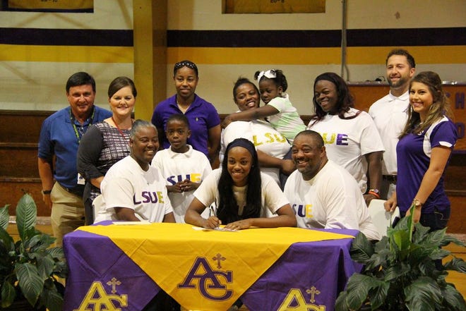 Ascension Catholic softball star Rae'Shaun Malancon signed with LSU-Eunice in the school gym last Thursday. Photo by Kyle Riviere.