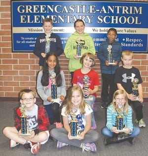 Receiving trophies were, from left: front row — third-graders, Jayden Pine (first place), Mikaela Oberholzer (second place), Jacqueline Plezia (third place); middle row — fourth-graders, Sajel Sriram (first place), Shelby Zimmerman (second place), Dallas Gaus (third place); back row — fifth-graders, David McKee (first place), Grace Murray (second place), David Humphrey (third place).