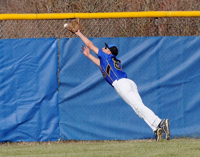 Jefferson's Corey Wilkens reaches for a ball in centerfield. (Monroe News photo by TOM HAWLEY)
