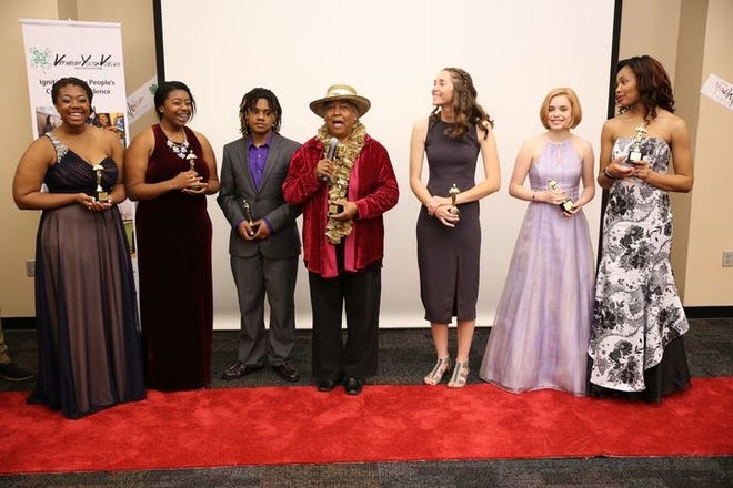 A 4-H team accepts their Oscars during the fifth annual Virginia Youth Voices Red Carpet 4-H Oscar Awards Expo held at the Science Museum of Virginia. Teams and individuals won awards for creative media projects. Contributed Photo