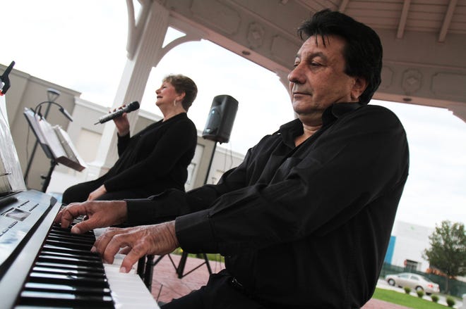 Ginny Conley and Bill Morretti are part of The Cavalcade of Bands at the Rhodes-on-the-Pawtuxet, in Cranston.

The Providence Journal/Bob Thayer