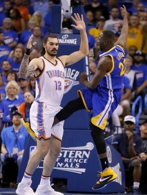 Golden State's Draymond Green (right) was fined $25,000 but not suspended Monday for kicking Oklahoma City's Steven Adams during Game 3 of the Western Conference finals on Sunday night. Game 4 is tonight with the Thunder leading the series, 2-1. The Oklahoman via AP