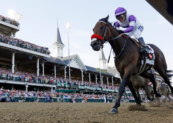 FILE - In this May 7, 2016, file photo, Mario Gutierrez rides Nyquist to victory during the 142nd running of the Kentucky Derby horse race at Churchill Downs in Louisville, Ky. The trainer of Nyquist says the Kentucky Derby winner is sick and won't run in the Belmont Stakes on June 11. Doug O'Neill said Tuesday, May 24, 2016, that Nyquist is "out because of sickness." (AP Photo/David J. Phillip, File)