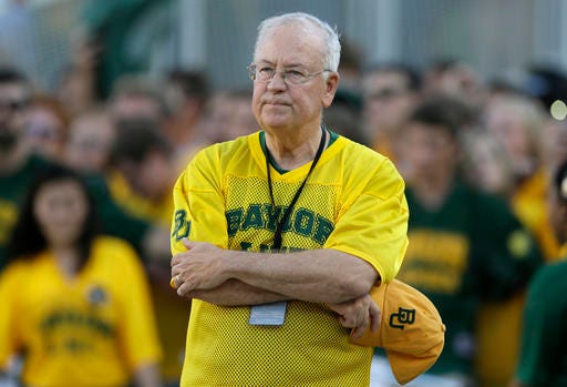 FILE- In the Sept. 12, 2015 file photo, Baylor President Ken Starr waits to run onto the field before an NCAA college football game in Waco, Texas. Baylor University officials say regents are still reviewing an investigation into how the Texas school handled reports of rape and assault by football players and expect to announce any actions by June 3, 2016. Baylor issued the statement Tuesday, May 24, 2016, after reports that President Ken Starr was fired. The school said it would not respond to "rumors."