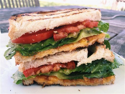 Two favorite sandwiches, the BLT and the grilled cheese, coming together as one, in New Milford, Conn. The buttery crunch of the bread, the juicy tomatoes, the melty cheese, the crisp bacon and lettuce, these two sandwiches were meant to find each other and become one. (AP Photo/Katie Workman)