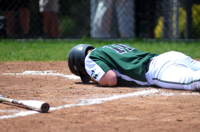 Riverside first baseman Kolby Wolf drops to the ground after getting hit in the face by a pitch. He was able to return and the Panthers defeated Keystone Oaks, 2-0, on Tuesday at Burkett Park.