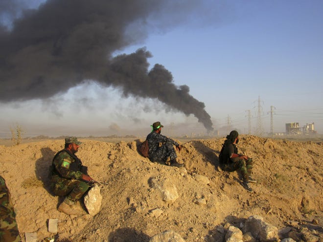 Smoke rises from Islamic State positions after an airstrike by U.S.-led coalition warplanes in Fallujah, Iraq.