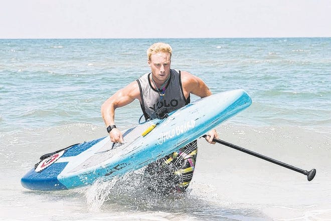 Garrett Fletcher places first in Florida Cup SUP Race.