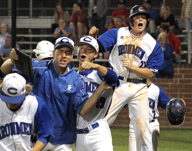 Cherryville's Will Walker, right, celebrates after he scored the tying run ahead of Carlton Jackson's winning run on Austin Treadway's double in the bottom of the sixth inning to give Cherryville a 3-2 win over Walkertown on Tuesday night. (John Clark/The Gazette)
