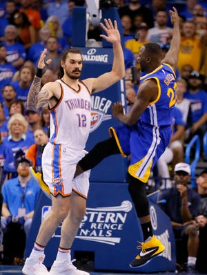 Golden State's Draymond Green, right, kicks Oklahoma City's Steven Adams in a highly personal region during Sunday's Game 3 of the NBA's Western Conference finals in Oklahoma City. The NBA fined Green but declined to suspend him for Tuesday's Game 4.