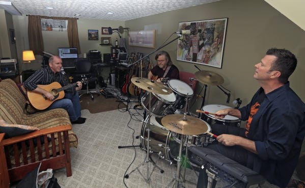 Rehearsing music from their album "Metal Man" are, from left, Ted Spradling, Deane Arnold and Steven Day Carter.