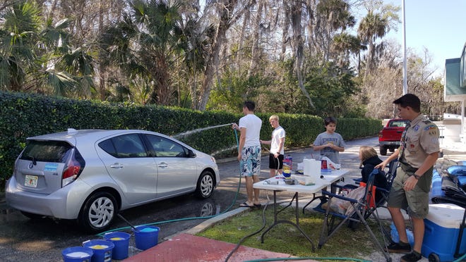 Ormond Beach resident and YMCA member, volunteer and coach Chase Williams, right, held a car wash recently to raise funds to refresh and renovate the furniture and toys in the Ormond Beach Family YMCA KidZone as part of the process of earning his Eagle Scout badge. In addition to being a scout, Williams is a junior at Spruce Creek High School in Port Orange. He is also a pole vaulter for the track and field team. The car wash raised nearly $400. The results of Chase's service to the YMCA will be unveiled 10 a.m. Saturday, May 21, at the YMCA's KidZone. Photo provided