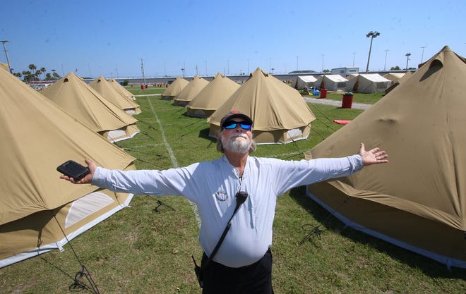 Tague Richardson, site director for the Country 500, stands among tents set up in the infield at Daytona International Speedway for music lovers who stay overnight during the three-day festival. Richardson and a crew of roughly 500 have been working this week to set up the two stages and backstage activities before Friday's start. News-Journal/JIM TILLER