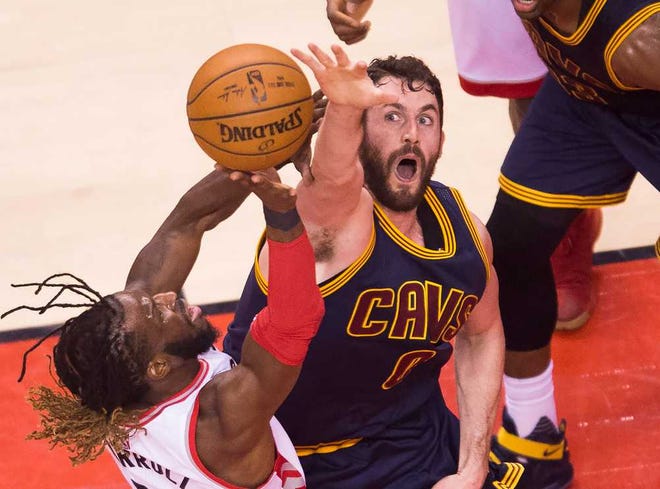 Toronto's DeMarre Carroll, left, and Cleveland's Kevin Love battle for a loose ball during Game 3 of the NBA's Eastern Conference finals. Game 5 is Wednesday.