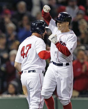 Brock Holt, right, is congratulated by Travis Shaw after hitting a two-run home run against Oakland on May 9.