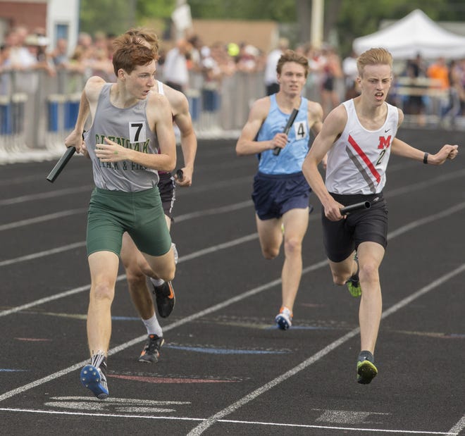 Alex Nupp left anchors the GlenOak's winning the 4x800 relay and moving on to state. (CantonRep.com / Bob Rossiter)