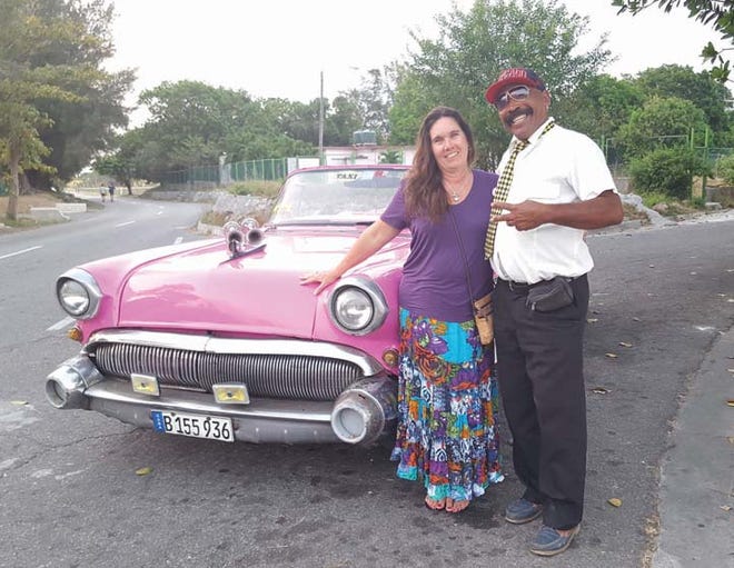 Fairfield Harbour resident Julie Mincey, left, poses with Jorge Furcado, who was her driver during her visit to Havana, Cuba.