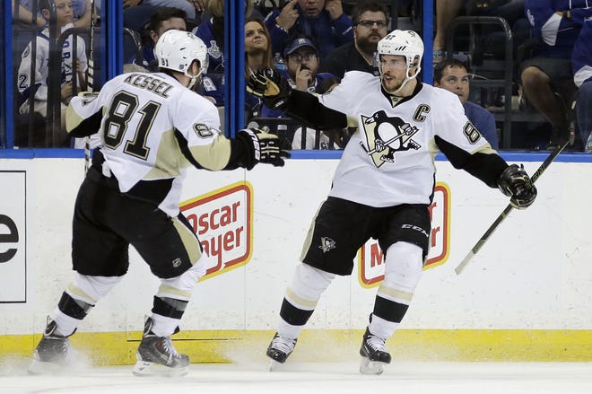 Penguins center Sidney Crosby (87) celebrates his goal against the Lightning with right wing Phil Kessel (81) during the second period of Game 6 of the Eastern Conference final Tuesday in Tampa, Fla. The Penguins have won their past 11 postseason games in which their captain has scored a goal.