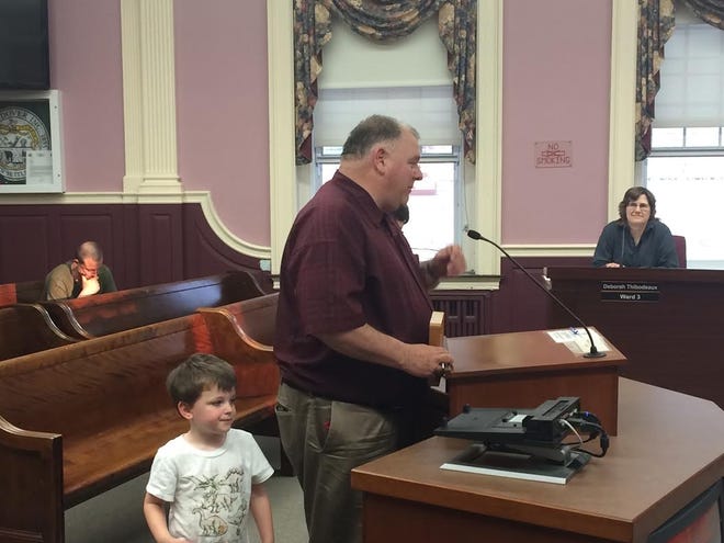 Dover Utilities Superintendent Bill Boulanger, with his grandsons Ari Laliotis and Lucas Boulanger-Laliotis, thanks the City Council after being recognized for an EPA award he won earlier this month. Photo by Nik Beimler/Fosters.com.