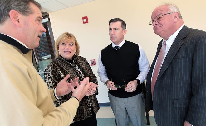 (Photo Mike Hensdill/The Gaston Gazette ) In this file photo, former Gaston Regional Chamber CEO Jeff Sandford, third from the left, talks to members at the David Belk Cannon Center at Gaston College in February 2015. The chamber board fired him this week.